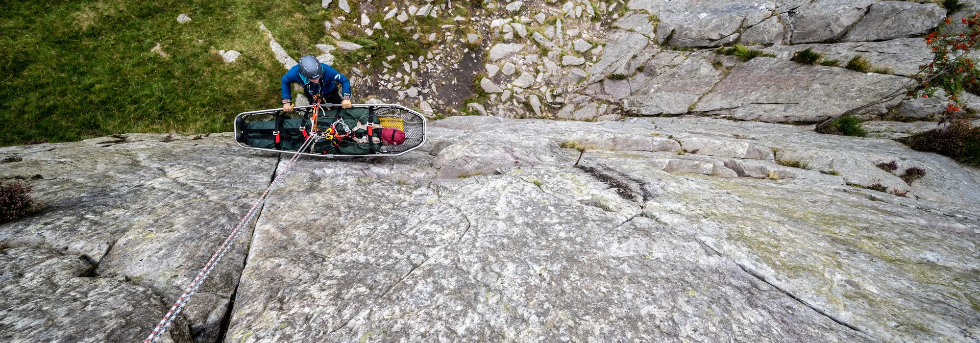 Medic and stretcher on a mountain during an Apex Technical Training medical and specialist response course