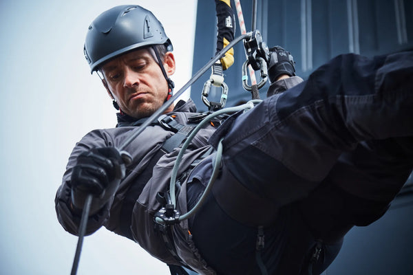 Apex Technical Training student abseiling off a balcony during a working at height course