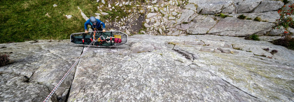 Medic and stretcher on a mountain during an Apex Technical Training medical and specialist response course